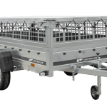 Einachsiger Anhänger auf Blattfedern 264×125 UNITRAILER GARDEN 264/R KIPP mit Gitterseitenwänden, H-0-Rahmen und grauer Plane-Neu